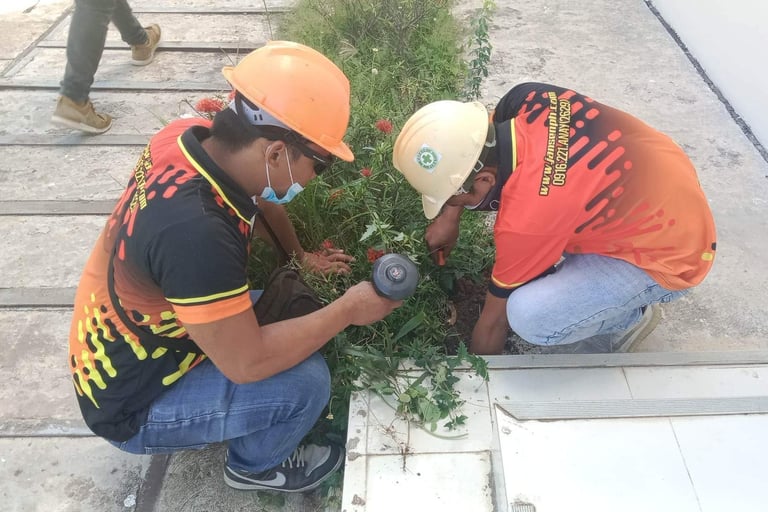 Jansen Pest Control Installing termite bait stations in Iloilo