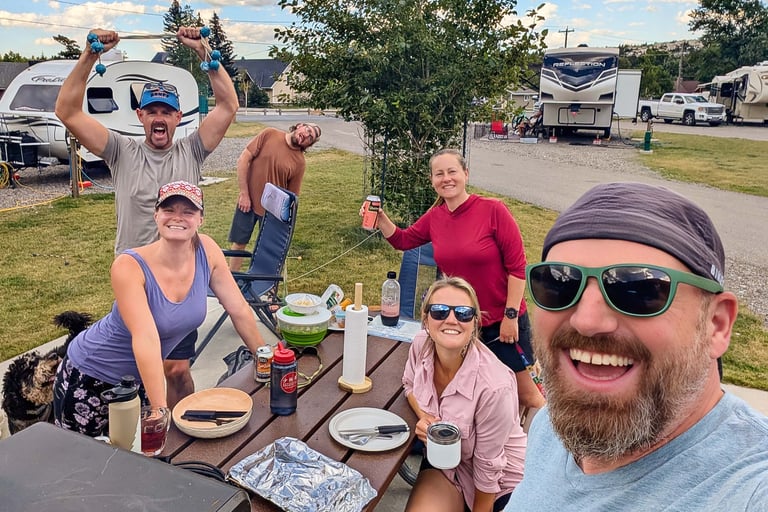 Friends enjoying dinner at Waterton Lakes Campground in Waterton Lakes National Park.