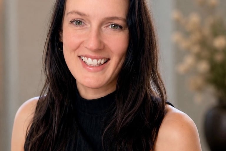 Headshot of Jenn Satre with soft background, in Minneapolis, MN