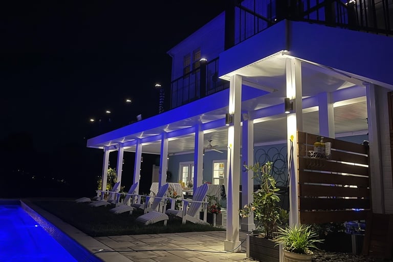 Modern backyard patio with luxury pool deck lighting and sconce lighting with speakers