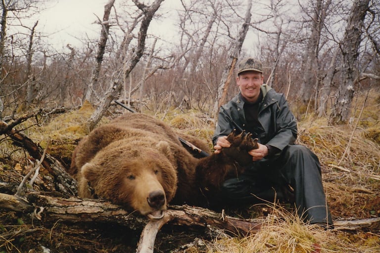 Heritage photo of a trophy grizzly bear harvest, showcasing long-standing guiding experience.