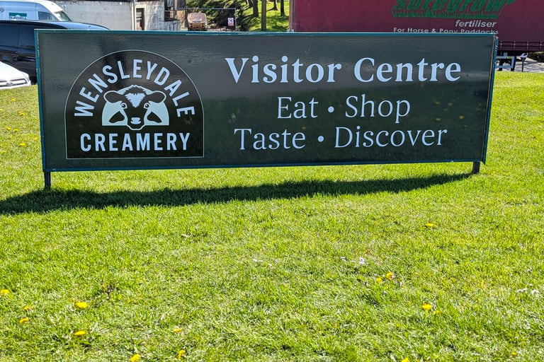 sign on the roadside at the entrance of the Wensleydale Creamery