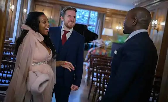 wedding guests chatting to the groom at Burgh House Hampstead