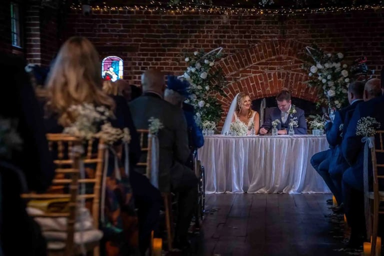 signing the wedding register at tudor barn