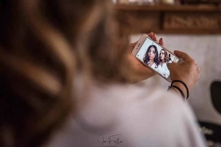 bride and bridesmaid taking a selfie