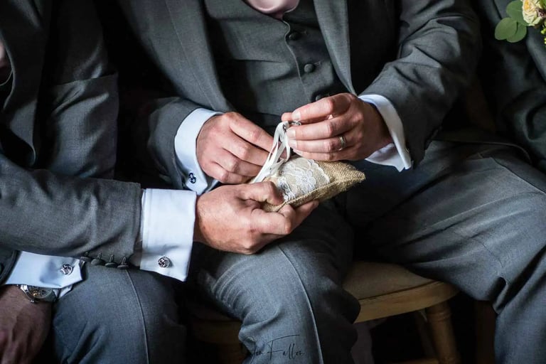 best man trying to find the wedding rings at the ceremony