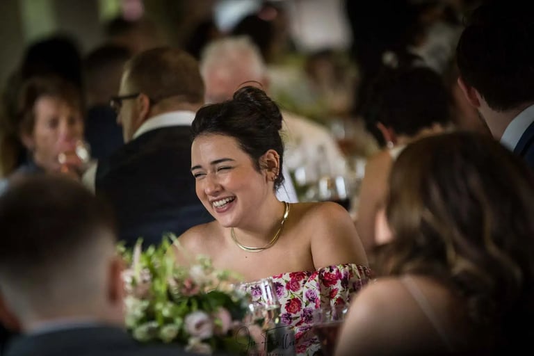 female wedding guest smiling
