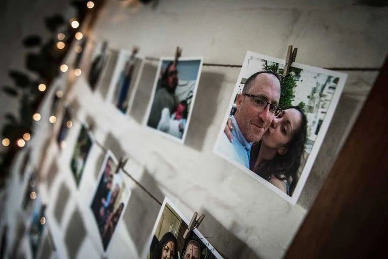 polaroid pictures hanging on wall