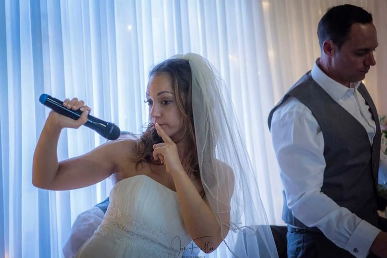 the bride takes the mic at Tudor Barn Eltham