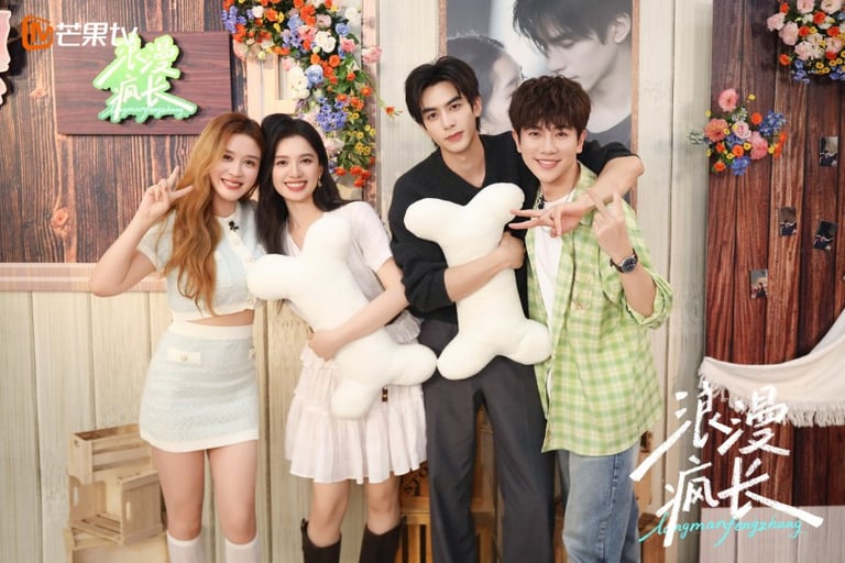 Cast members of the Chinese drama Longman Fengzhang posing together with bone-shaped plush pillows.