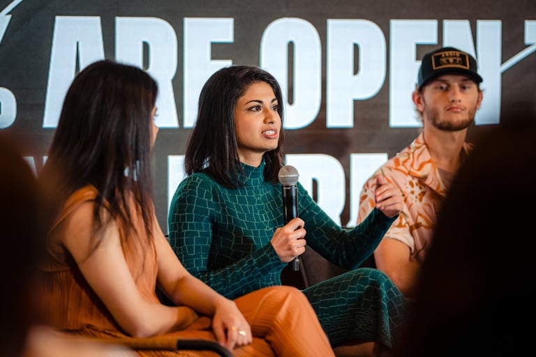 Niki Shamdasani speaking on TikTok growth panel at TikTok event, handheld mic, audience Q&A