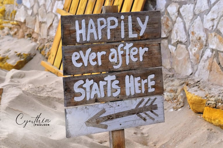 Beach wedding sign in Brookings Oregon reading “Happily Ever After Starts Here”