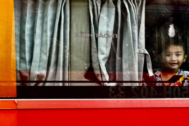 Boy in bus, Western bus station, Saigon, Vietnam