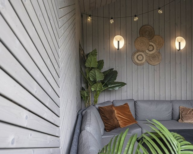 a couch with a couch and some plants