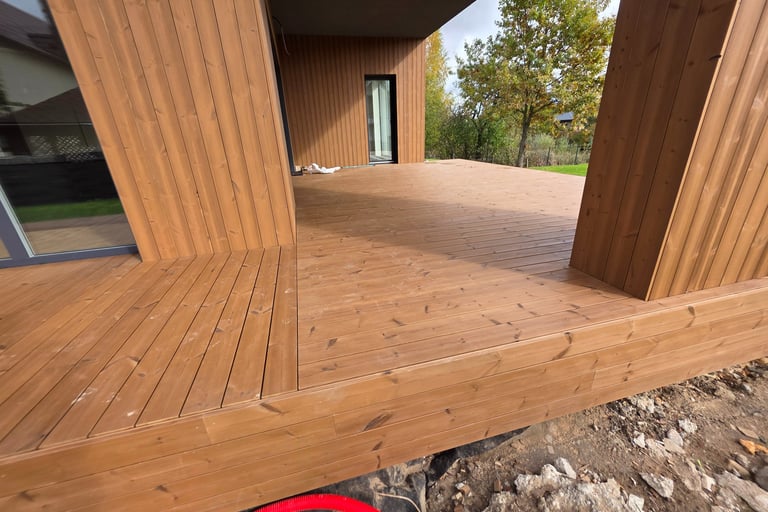 a wooden deck with a red circle in the middle