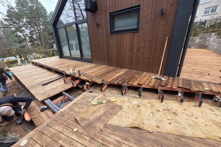 a man is fixing a deck deck with a deck