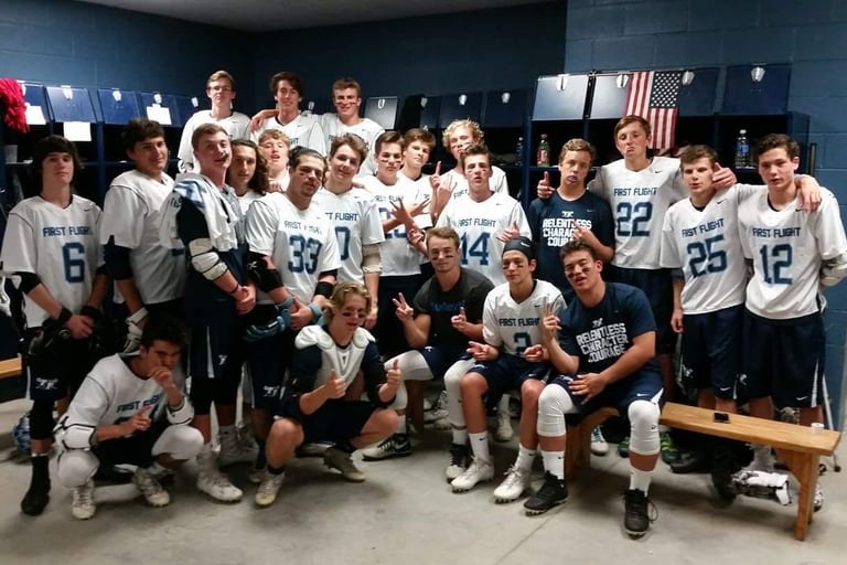 First Flight lacrosse players in locker room, 2017.