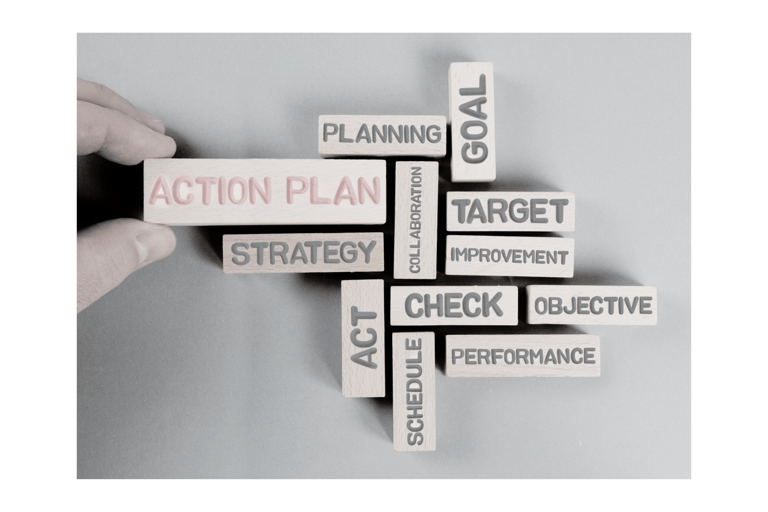 a person holding a block of wood blocks with words on it