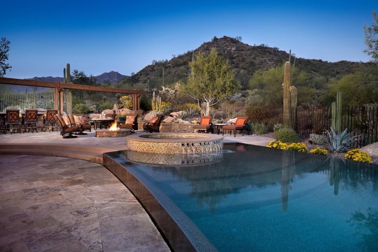 a pool with a fire pit and a fire pit