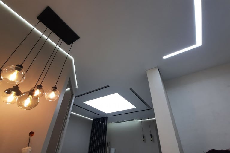 a bathroom with a skylight and a skylight fixture