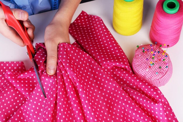pink fabric being cut to create a keepsake