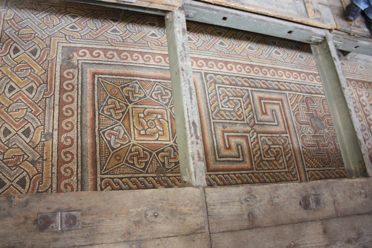 Mosaic floor protected by glass walkway in the Church of the Nativity