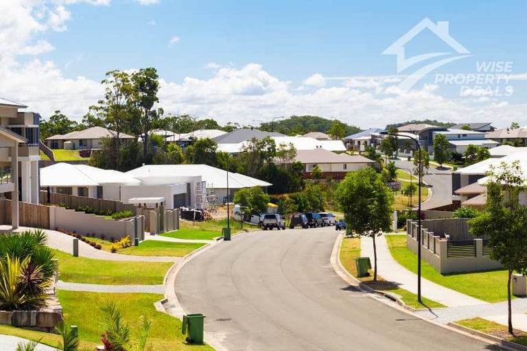 a street scene with a car parked on the side of the road