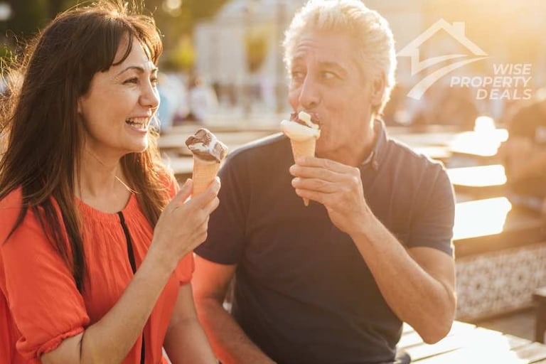 a man and woman eating ice creams