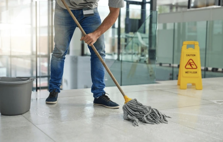 man mopping floor