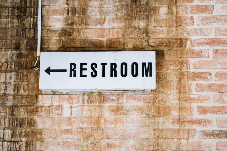 directional restroom sign