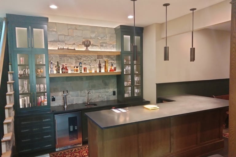 Residential wet bar with granite countertops and stone backsplash sealed in Greenwood, SC