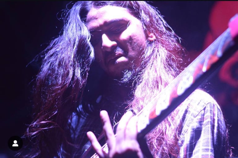 Mohanish Deshmukh, a guitarist, performs with his band Dark Helm at an Orange Octopus event in 2016