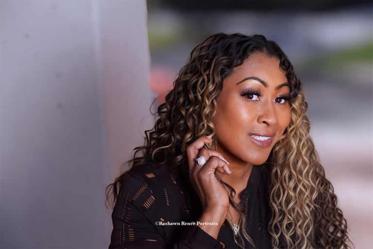 a woman with curly hair and a black shirt Business head shots