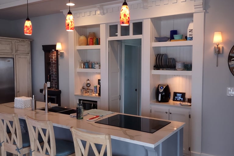 a kitchen with a large island and bar stools