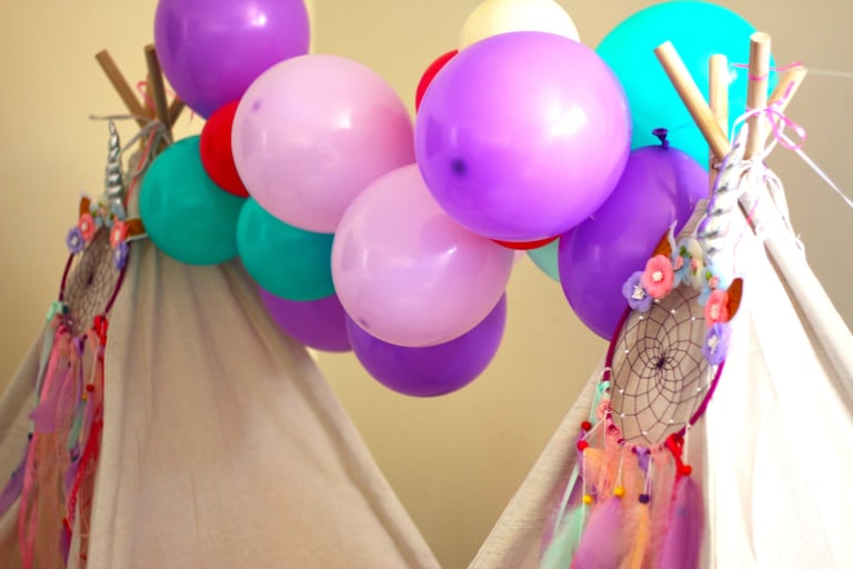 teepee slumber hire unicorn dreams theme with balloon garland