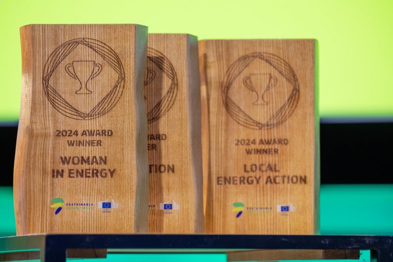 two wooden plaques with a woman in a white dress