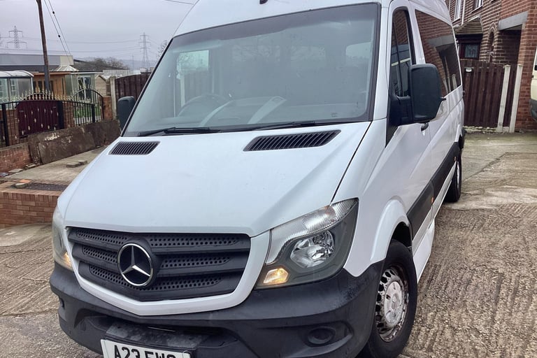 White Mercedes-Benz Sprinter van parked on a residential driveway in the UK.