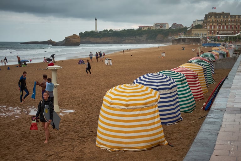 a beach with many umbrellas and umbrellas