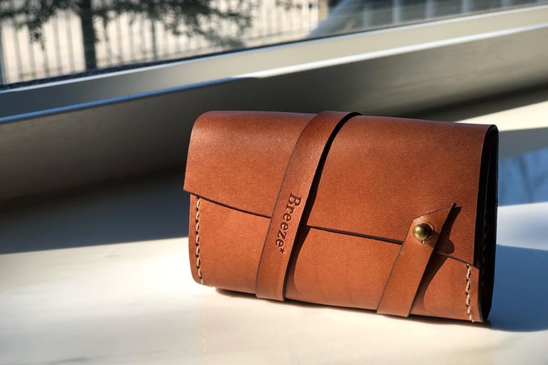 Premium handmade brown leather wallet with wrap strap and brass button