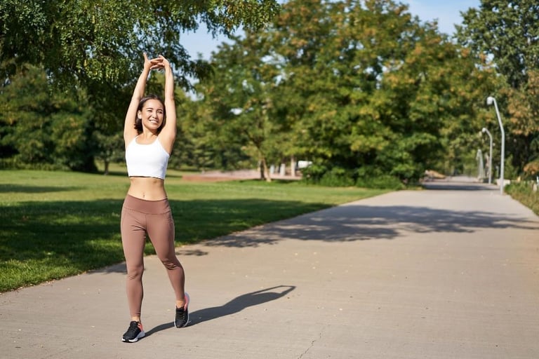 asian girl stretching after good workout in park
