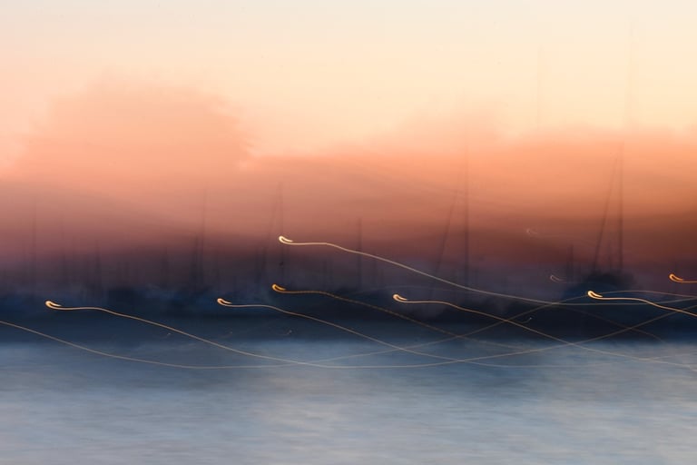 Intentional camera movement: pale blue and blush night in the harbour.