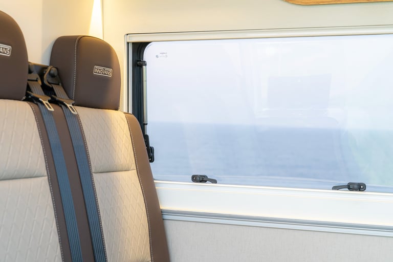 a seat in a van with a window close