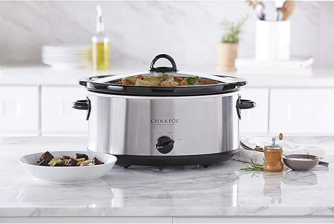 Crock-Pot 7 Quart Slow Cooker filled with a hearty beef stew ready to serve a large family.