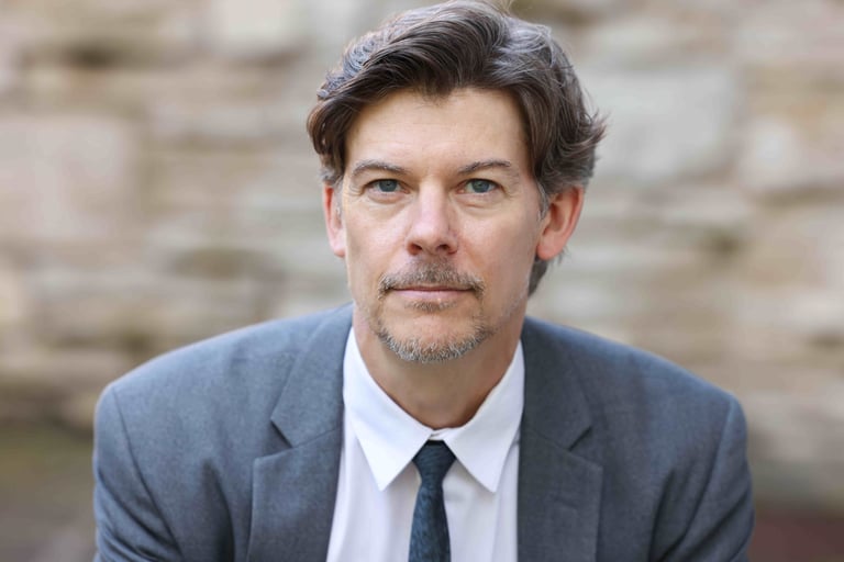 Headshot of Andrew Ludington, author.