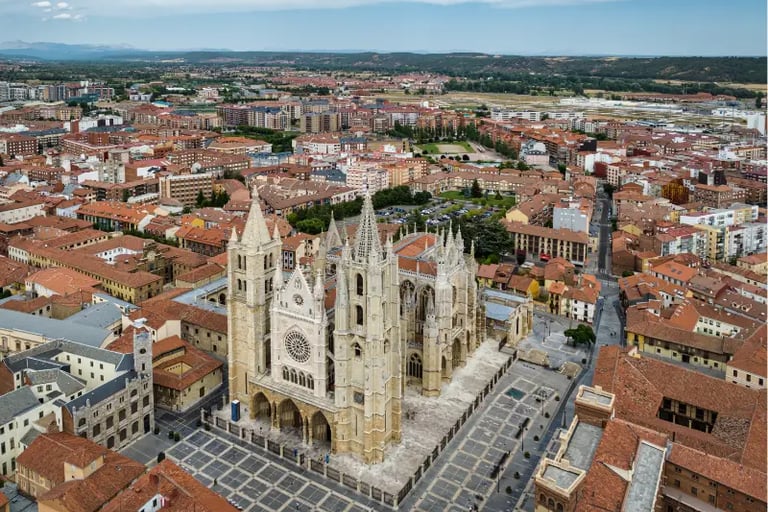 Aerial view of the Gothic Leon Cathedral and historic cityscape in Leon, Spain.