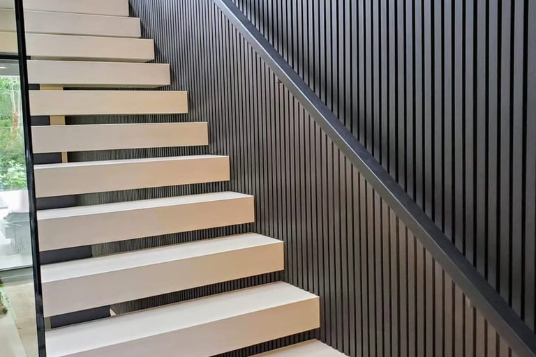 Modern floating staircase design with wide wood treads and vertical slat wall accent