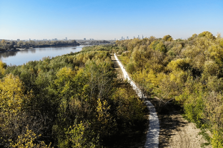 Aerial view of a scenic walking path along the Vistula River in Warsaw during autumn.