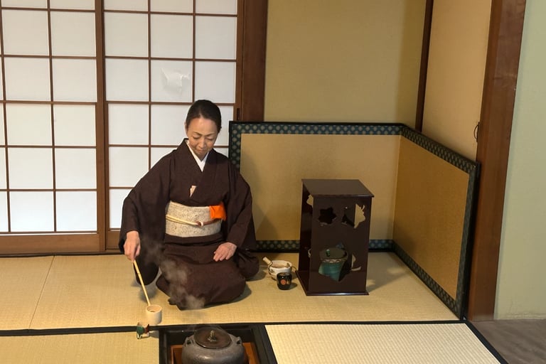 Tea ceremony master whisking matcha during a traditional tea ceremony