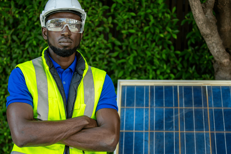 a man in a safety vest and safety glasses