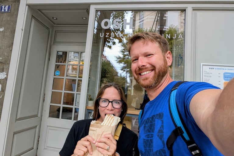 Don and Samantha eatting a plove wrap outside Osh restaurant Belgrade serbia
